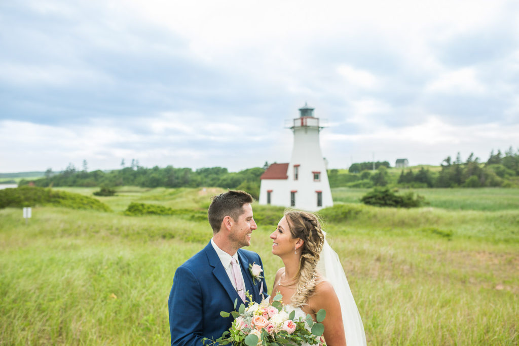 Wedding couple in front of New London Lighthouse PEI